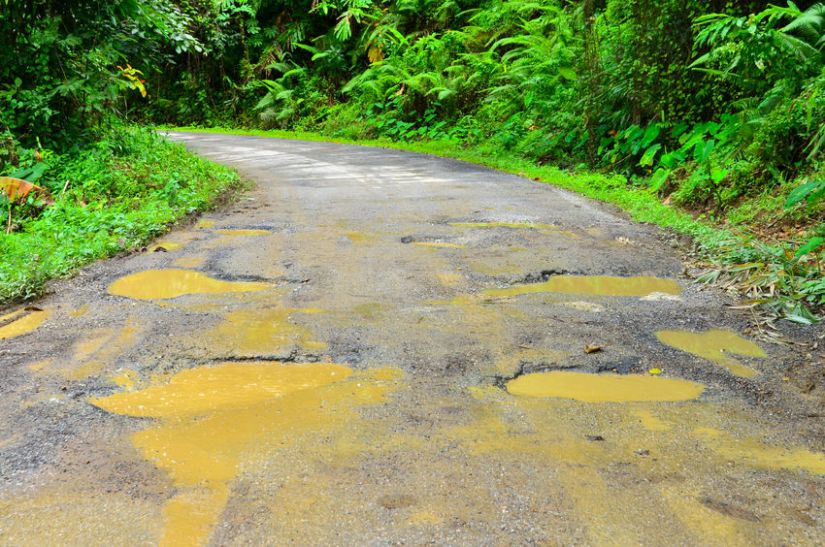 22585223 - damaged asphalt pavement road and potholes.